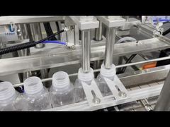 Machine automatique de remplissage et d'étanchéité des bouteilles en plastique